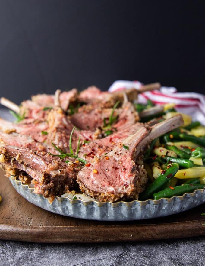 Close up of sliced up rack of lamb on a platter 