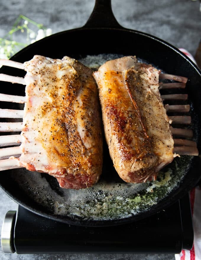 Flipped rack of lamb showing the golden sear