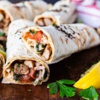 Close up of a Tantuni cut in half showing the lamb filling