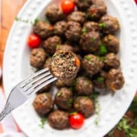 close up of one bitten air fryer meatball showing the texture and juicy meatballs