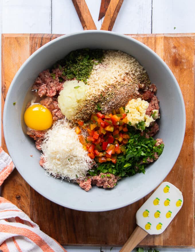 All the ingredients that were in small bowls are added to the bowl of minced beef