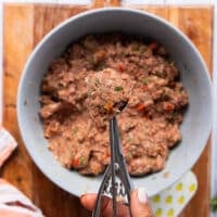 A scoop filled with the air fryer meatballs mixture