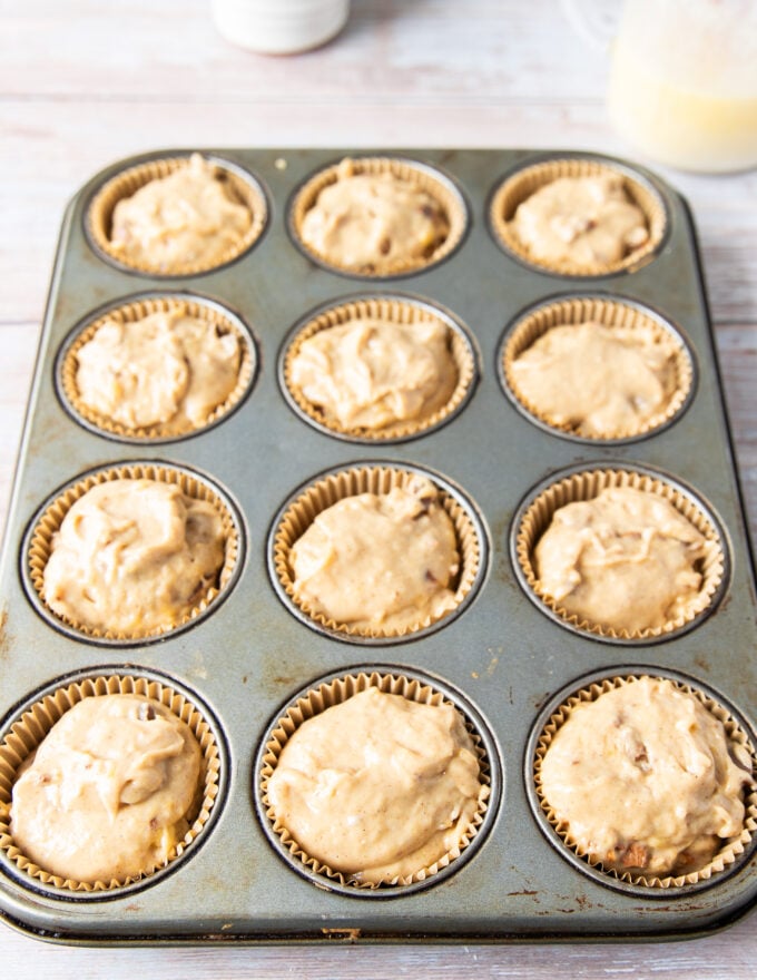 banana bread muffins in the muffin tin ready to bake now