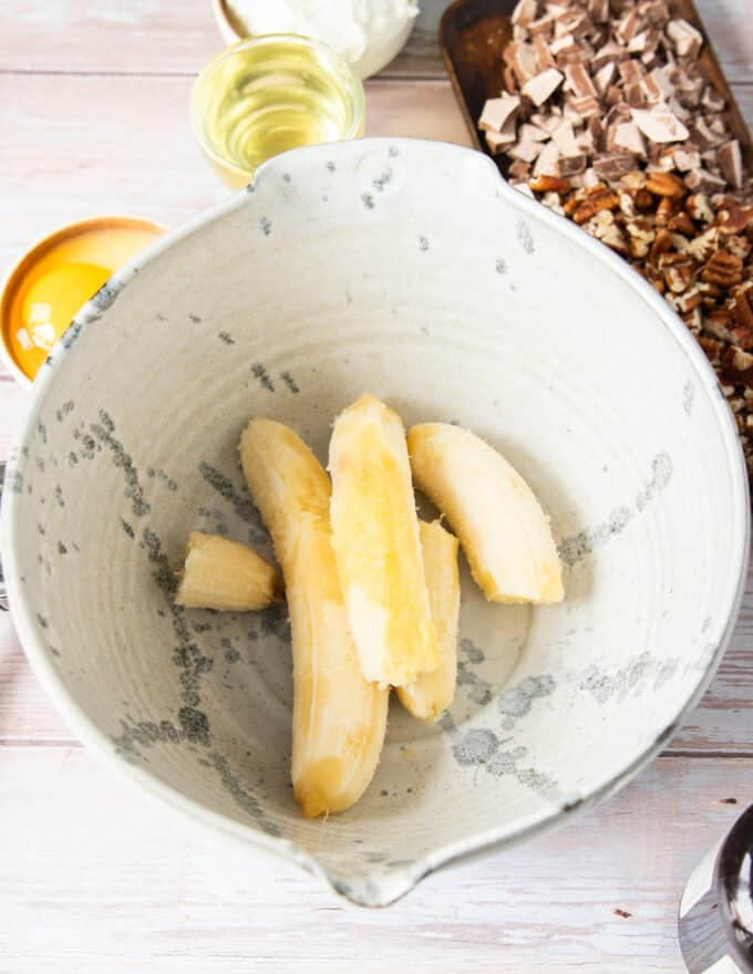 Peeled over ripe bananas in a large bowl ready to mash