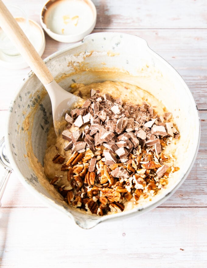 Optional chocolate chunks and chopped pecans are added to the batter to be folded in to complete the banana bread muffins batter