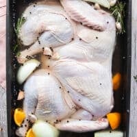 The turkey placed in to the brining solution in the large pan