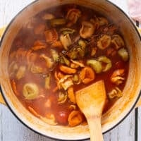 Tortellini fulled cooked in the tomato broth and tortellini soup is ready for cream or can be eaten as is
