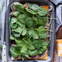 A layer of spinach added over the turkey meat