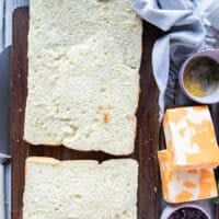 The slider rolls bread cut in to a top half and the bottom half while the sliders remain intact