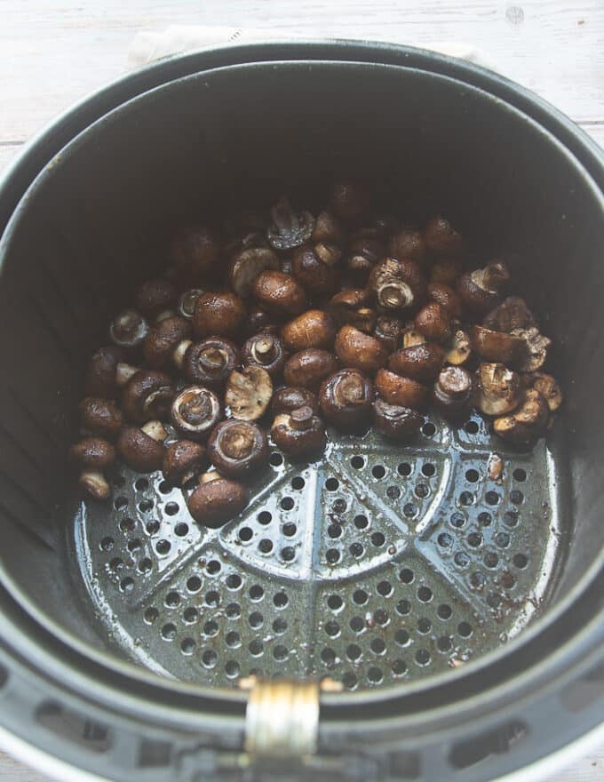 Cooked mushrooms in the air fryer basket