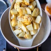 A plate of diced baked potatoes after being ready and baked now added to the soup