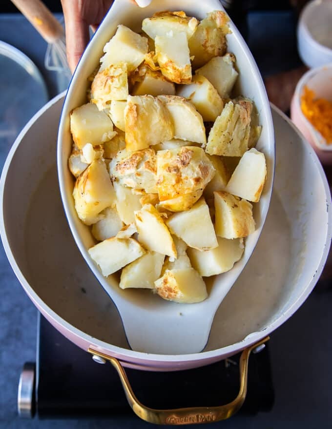 A plate of diced baked potatoes after being ready and baked now added to the soup 