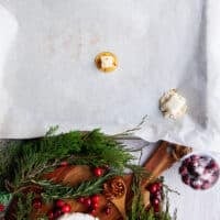 A chunk of cut up brie cheese is placed over the hot honey