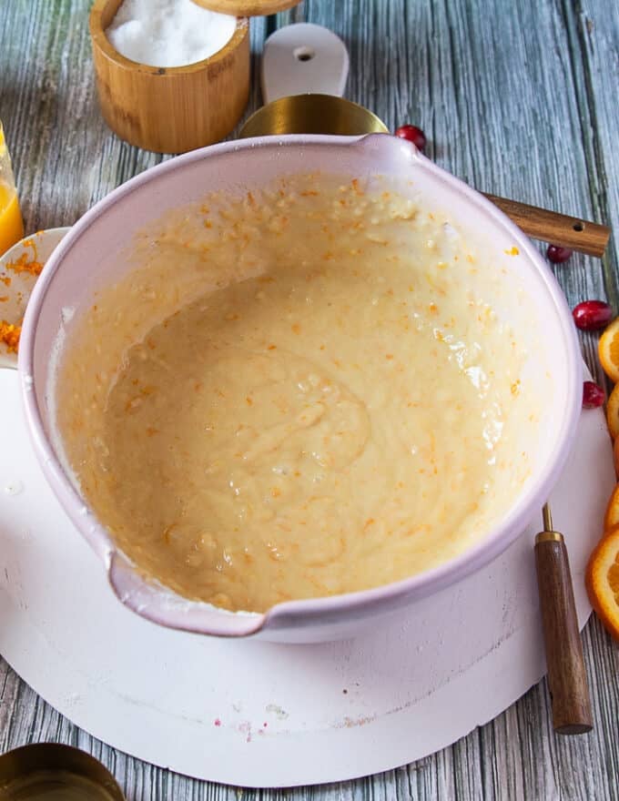 The orange cranberry batter mixed in the large bowl and ready for the cranberries 