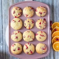 The baked cranberry orange muffins in the muffin pan ready and out of the oven