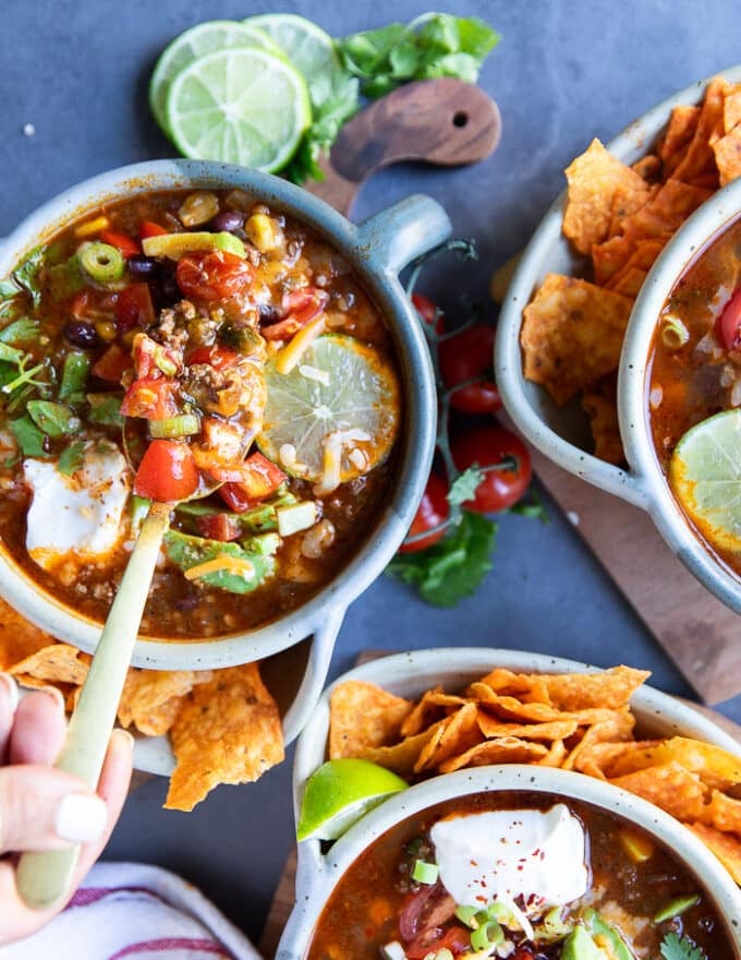 A spoon inside a taco soup recipe showing the textures and consistency of the taco soup