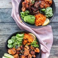 The salmon bites are added in the middle of the bowl over the rice and surrounded by all the veggies.