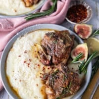 Close up of lamb loin chops seared and cooked, served with the fig rosemary butter and served over mashed potatoes