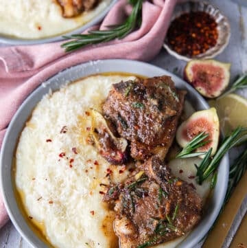 Close up of lamb loin chops seared and cooked, served with the fig rosemary butter and served over mashed potatoes