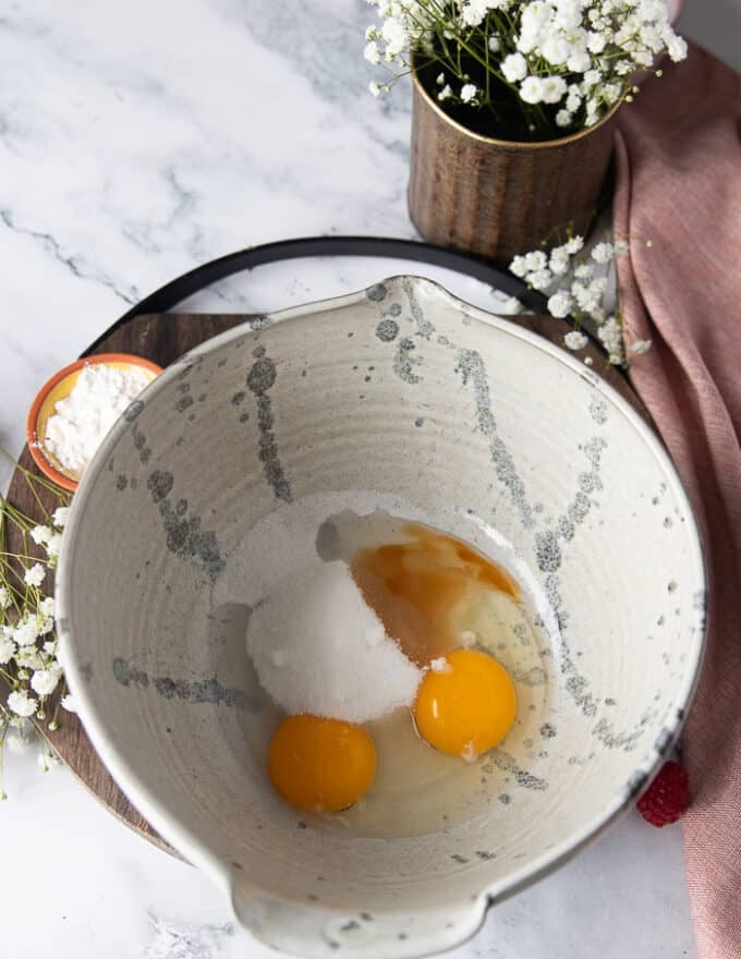 The cake batter bowl with egg, sugar and vanilla added