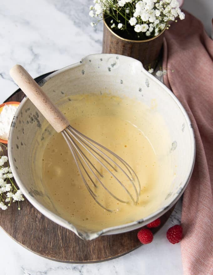 The eggs and sugar whipped super light and fluffy in a bowl