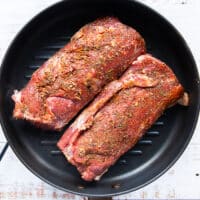 The lamb loins in a grill pan to cook