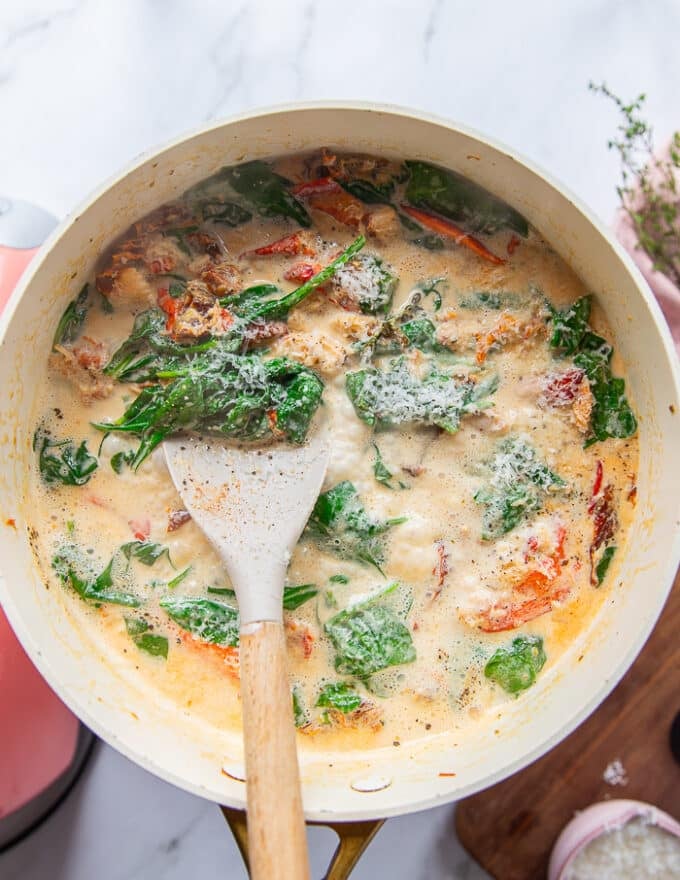 The creamy lobster sauce is ready in a skillet and cooked 