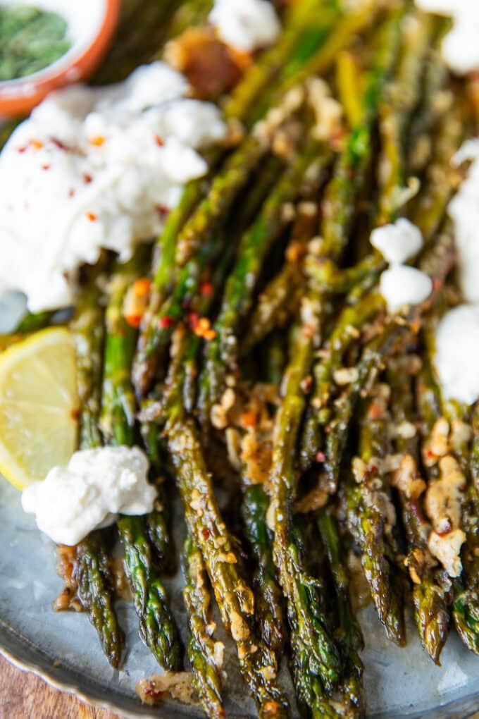 close up of the roasted asparagus showing in the crisp texture and vibrant green color 