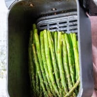 The asparagus perfectly cooked in the air fryer perfectly golden crisp and aldente on the inside