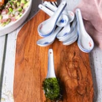 A small spoon with a piece of seaweed at the bottom