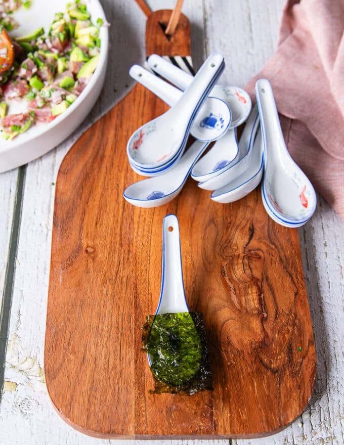 A small spoon with a piece of seaweed at the bottom