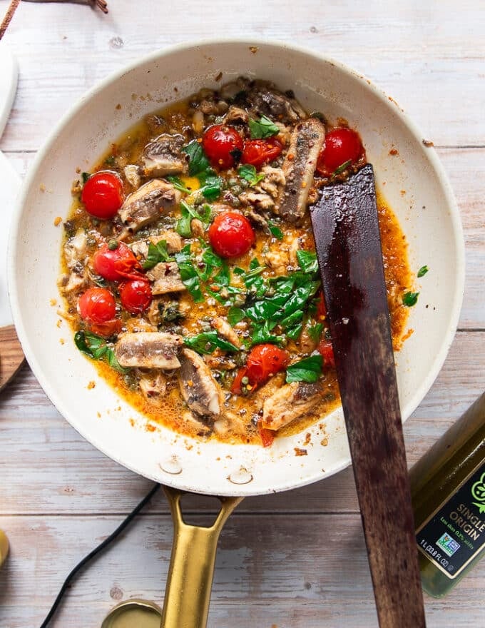 Lots of fresh basil and fresh oregano added to the skillet once the sauce is finished 