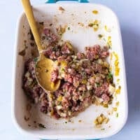 Beef mixed with the ingredients in a shallow plate