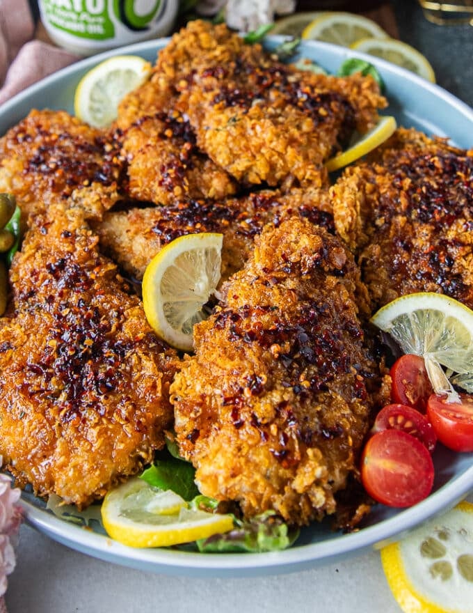 Close up of hot honey chicken dressed with honey and ready to serve 