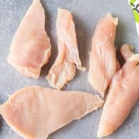 chicken tenders on a cutting board
