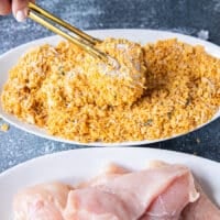 The chicken tender is then placed in the bowl of seasoned cornflakes for the final coating