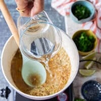 water added to the rice so it can cook