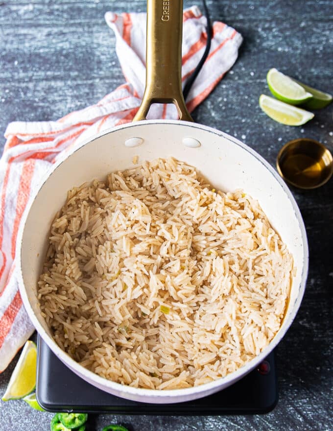 fully cooked fluffy long grain rice in a pot 