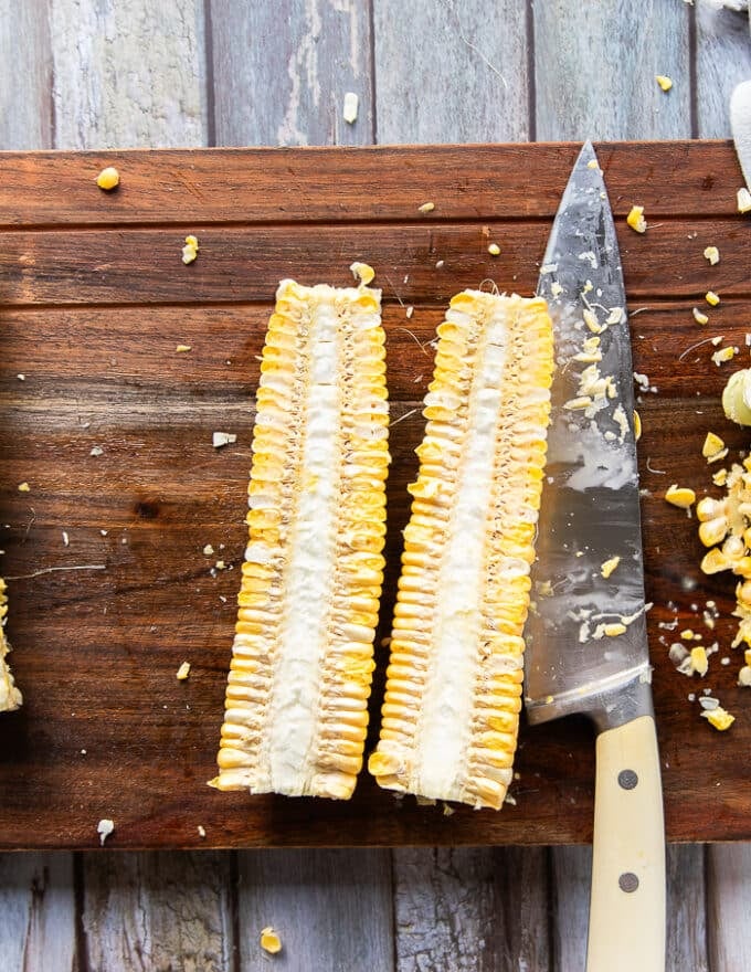 One corn on the cob cut in half lengthwise 