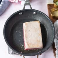 the tuna flipped on the other side for cooking another minute