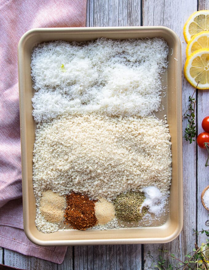 in a baking sheet the dry coating is added but not mixed. There's panko, parmesan cheese, lots of seasoning like garlic powder, oregano and paprika 