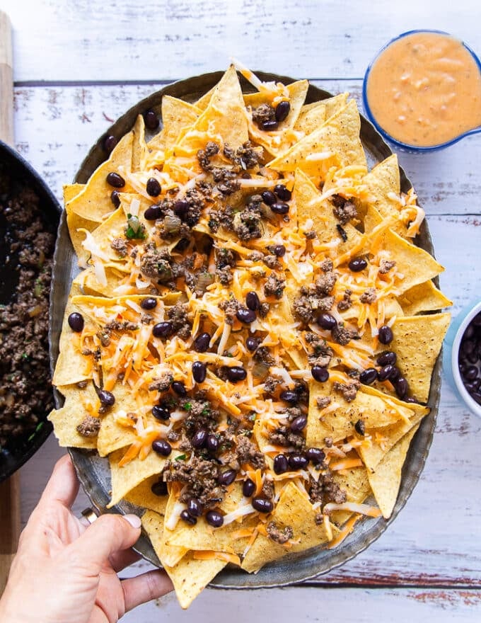 the plate of nachos ready to go in the oven 