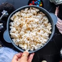 the popped kernels in the popcorn maker ready