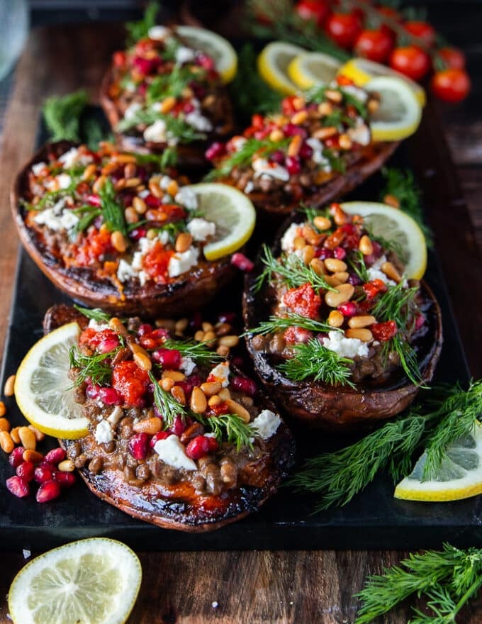 A side view of the plate of stuffed sweet potatoes showing deatils of the soft roasted sweet potatoes and the vibrant tasty stuffing