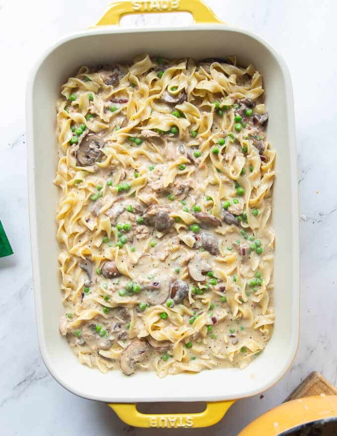 the noodles mixed into the post with the remaining ingredients and spread into a baking dish 