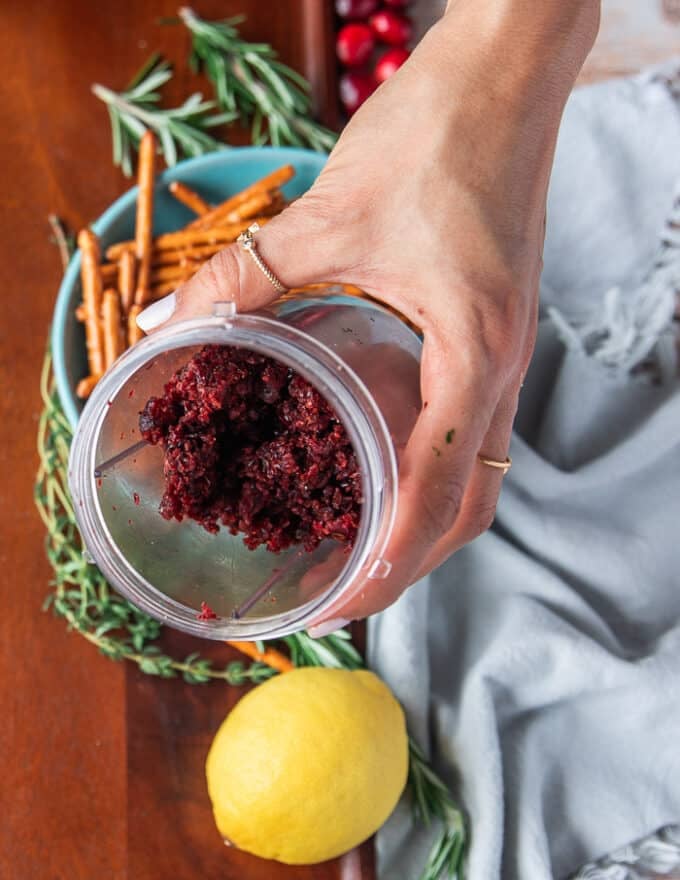 A mini processor bowl with minced cranberries