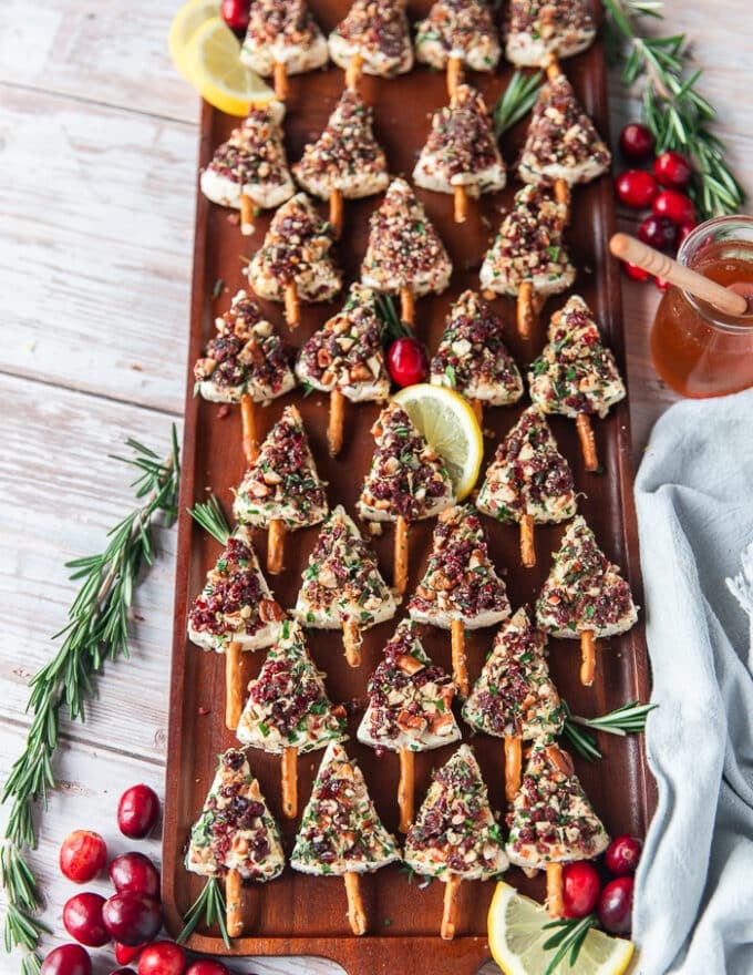 The board filled with chritsmas cheese trees assembled and ready to chill until serving
