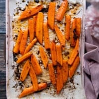 Roasted carrots out of the oven, golden, tender and ready for the other half of the glaze