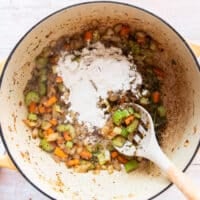 Flour is added to the mirepoix in the pot to make lobster bisque