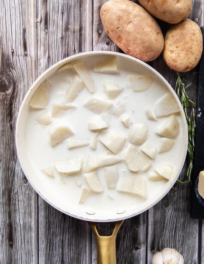 perfect amount of milk and cream added over the potatoes, not too much, just enough to cover it so it can soak it up.